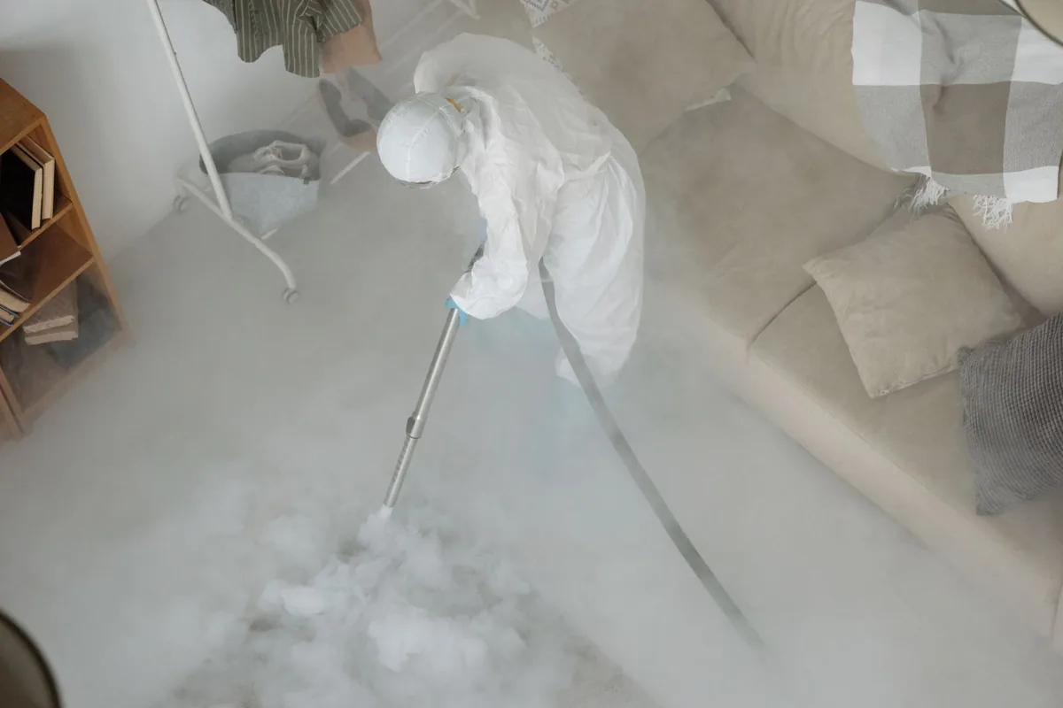Biohazard cleanup technician in protective equipment, Midtown, San Antonio, TX
